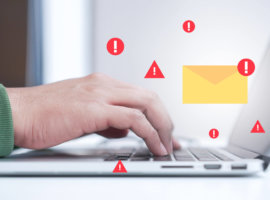 close up programmer man hand typing on laptop keyboard to protec