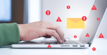 close up programmer man hand typing on laptop keyboard to protec